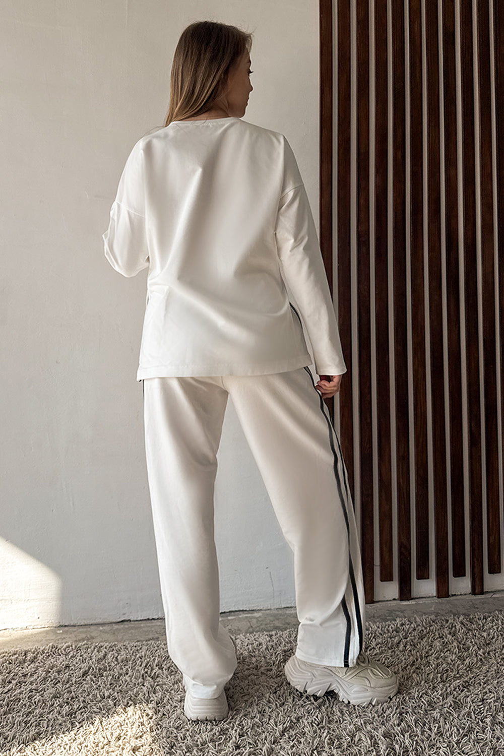 Milk suit with contrasting stripes
