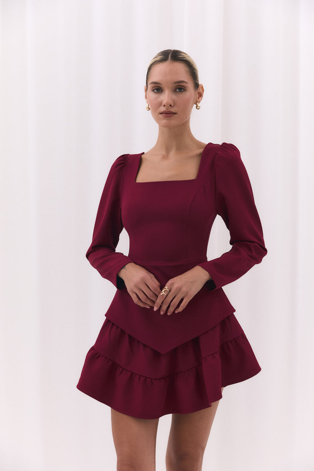 Burgundy blouse with a figured peplum