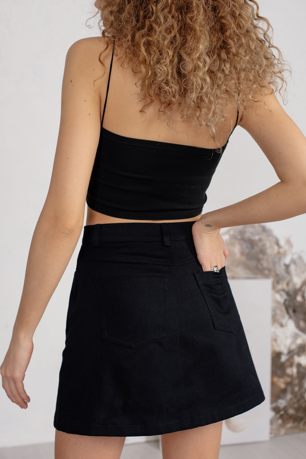 Black denim mini skirt