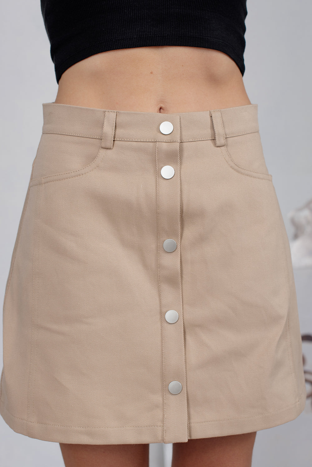 Beige mini skirt with pockets