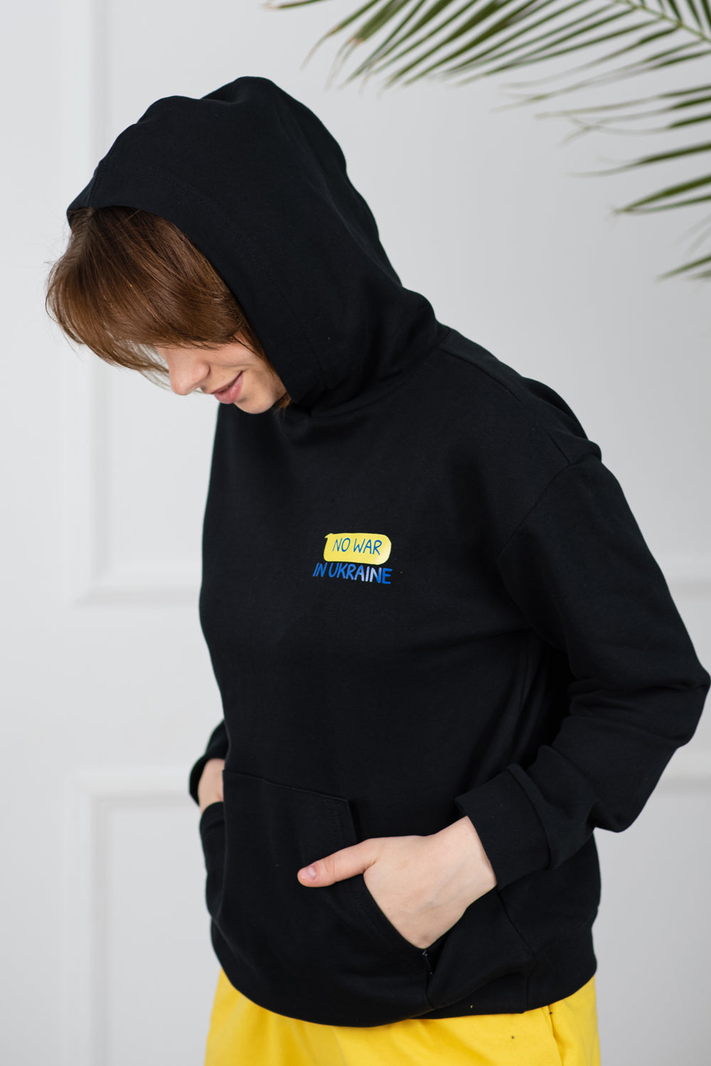 Stylish women's hoodie black "No war in Ukraine"