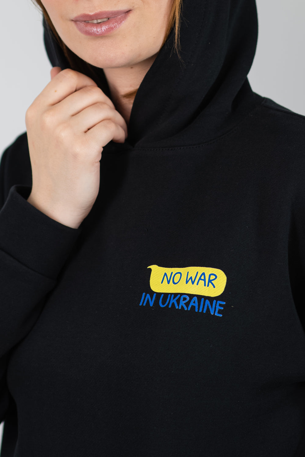 Stylish women's hoodie black "No war in Ukraine"