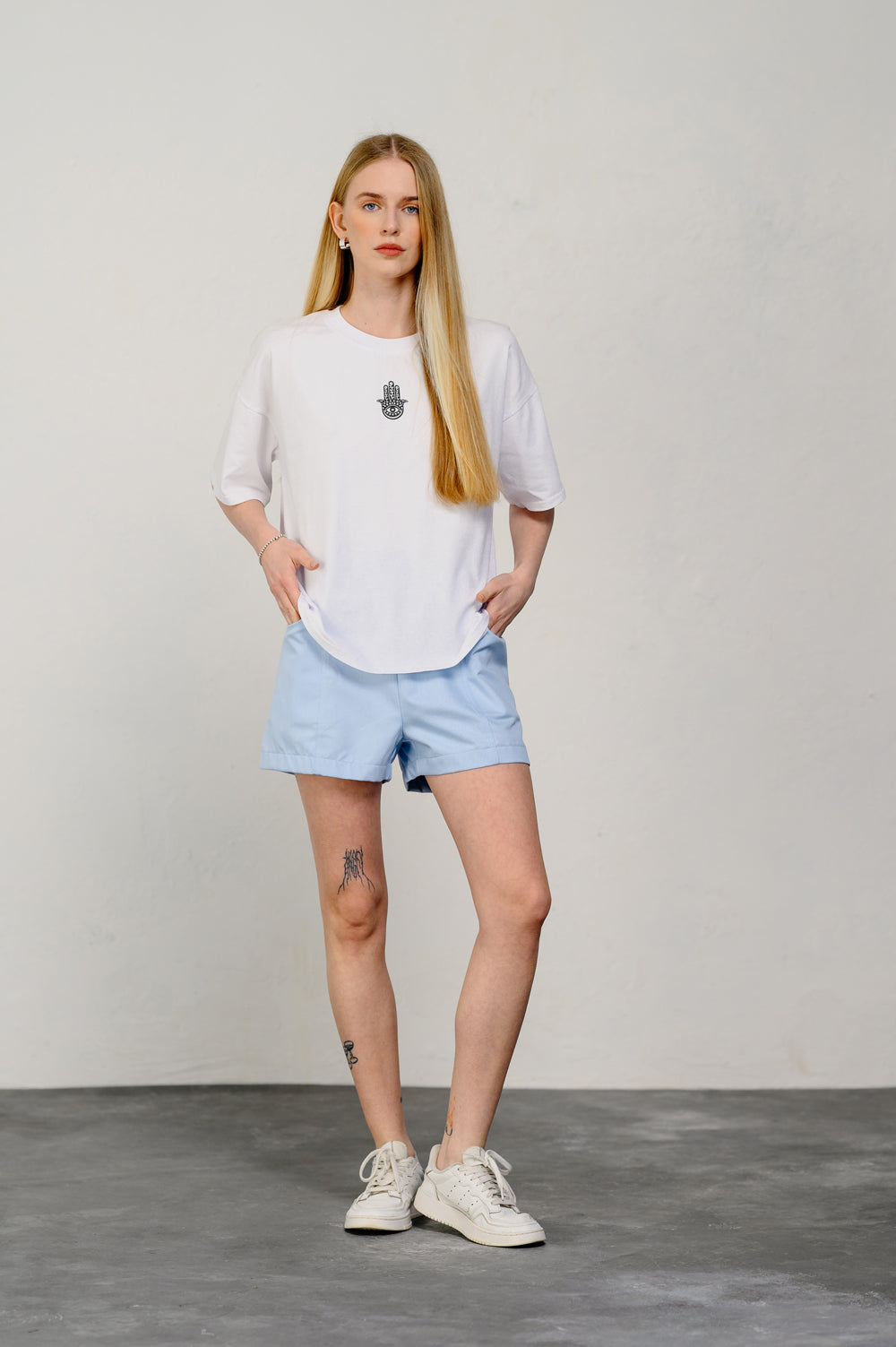 Oversized white T-shirt with sticker