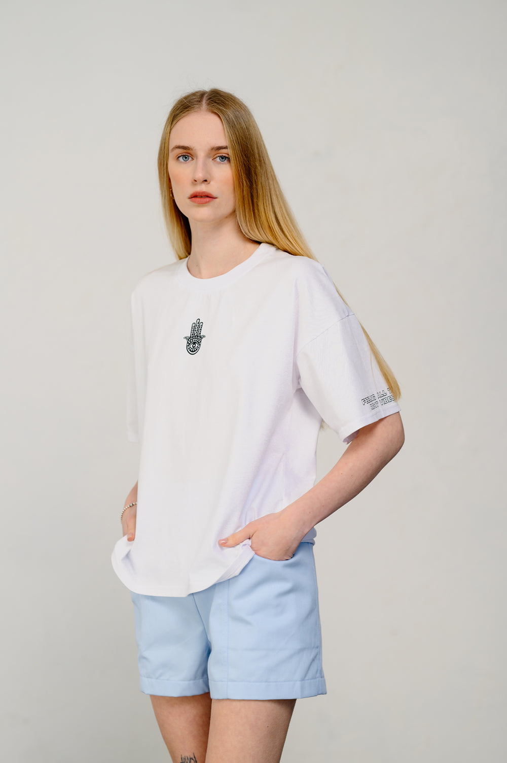 Oversized white T-shirt with sticker