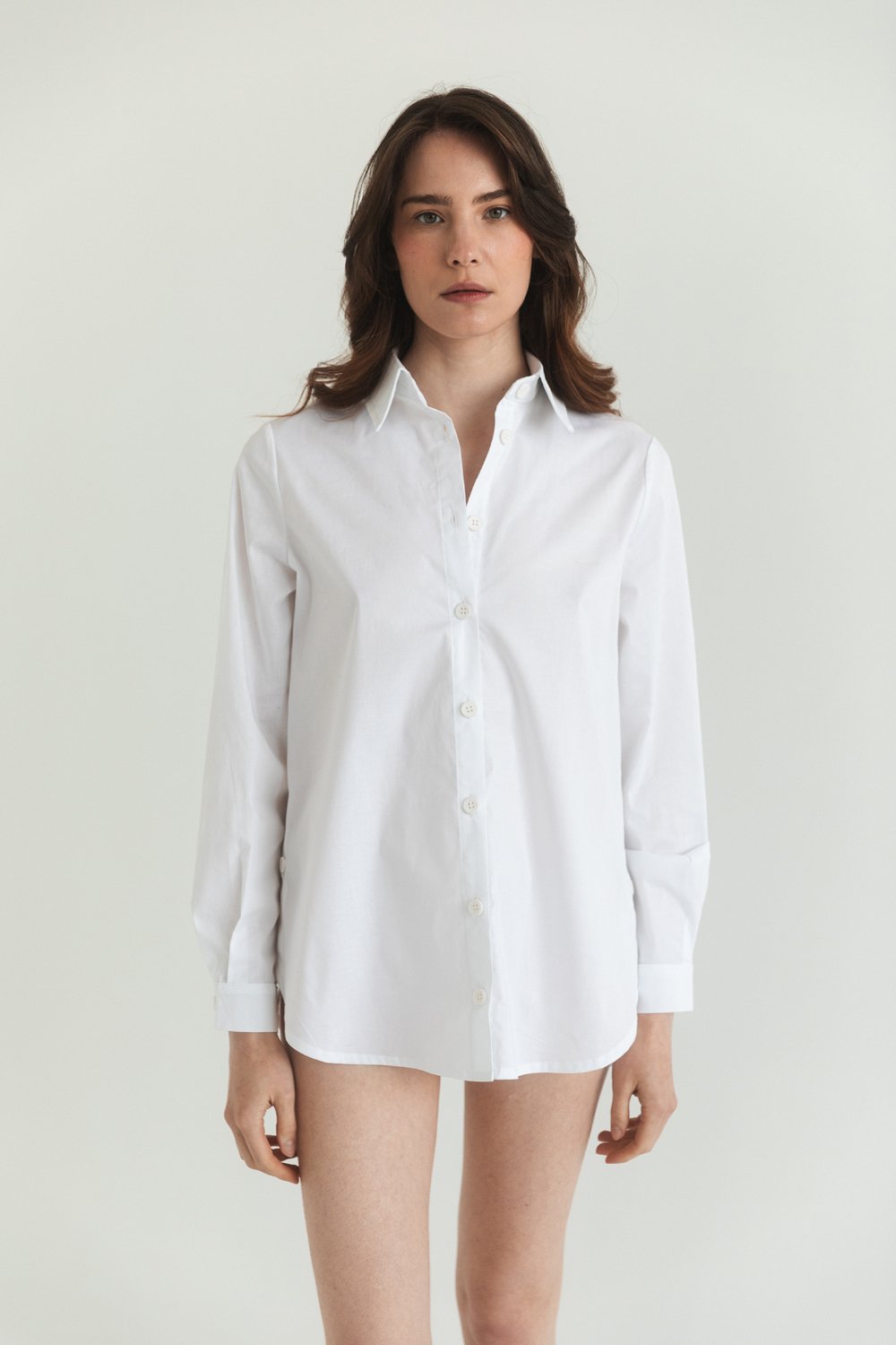 White cotton shirt with functional buttons on the sides