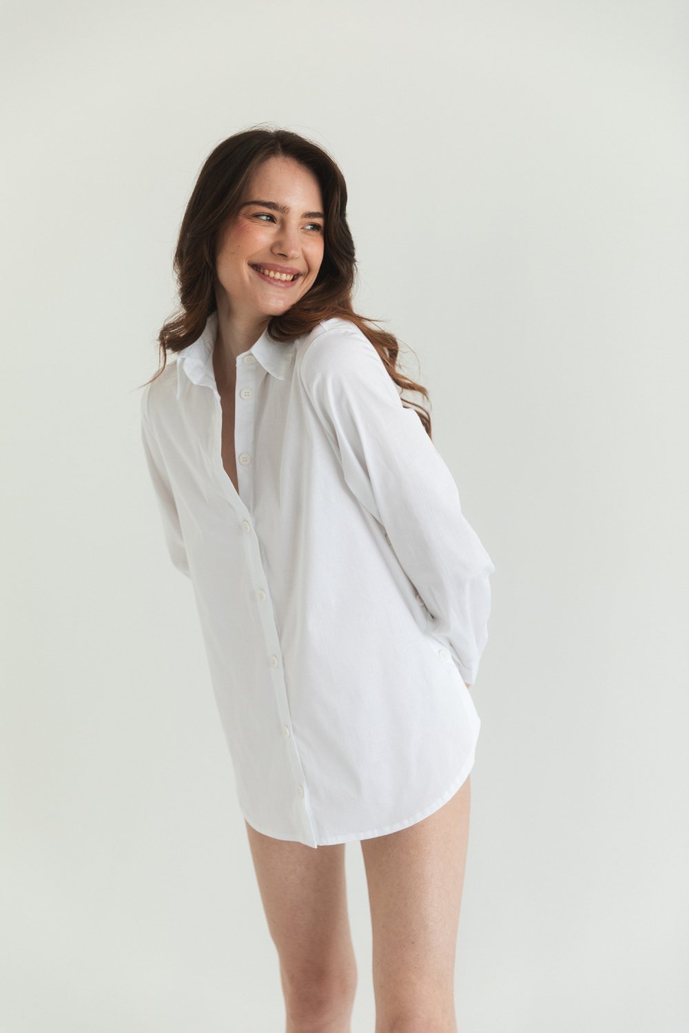 White cotton shirt with functional buttons on the sides