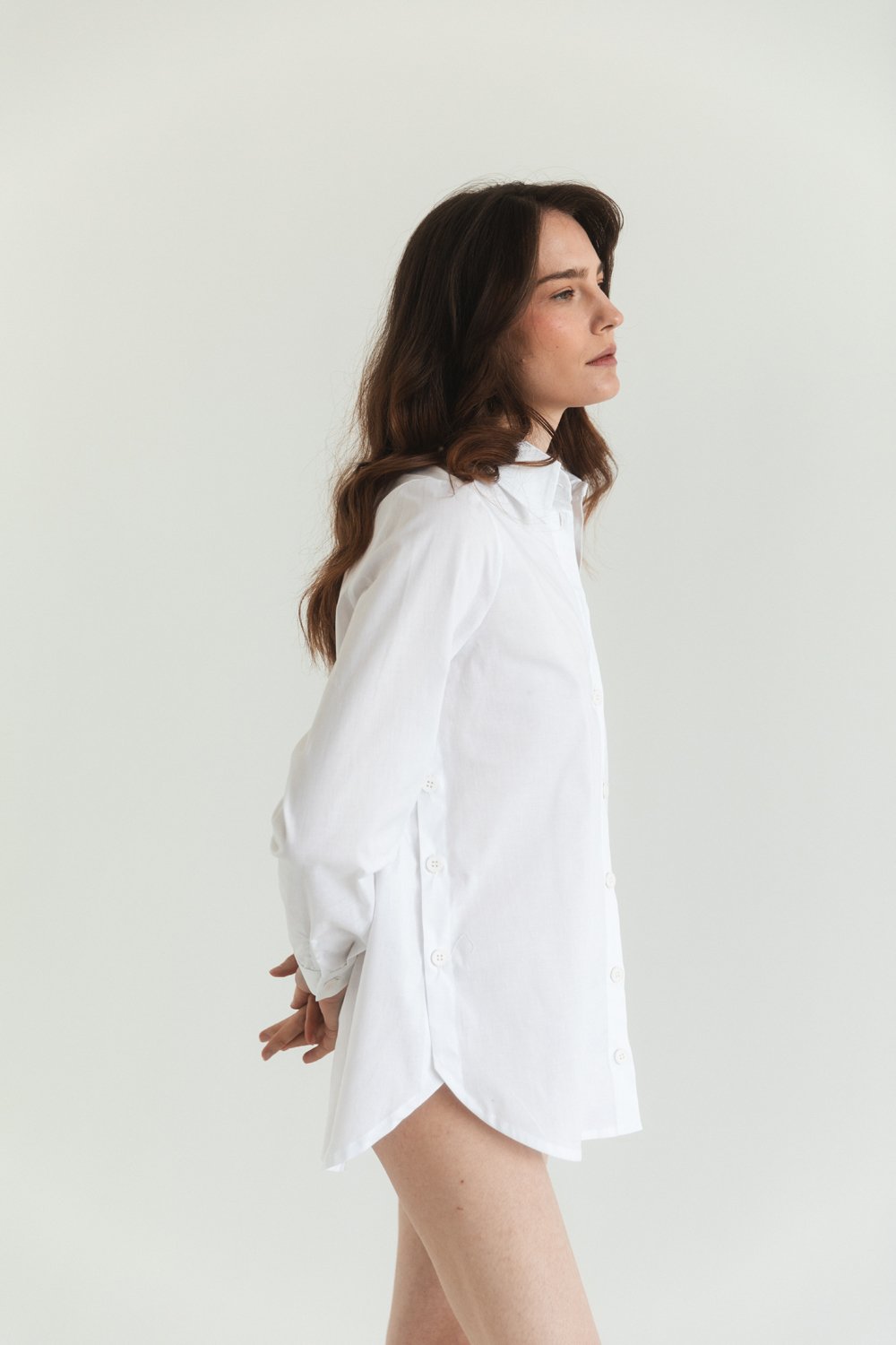 White cotton shirt with functional buttons on the sides