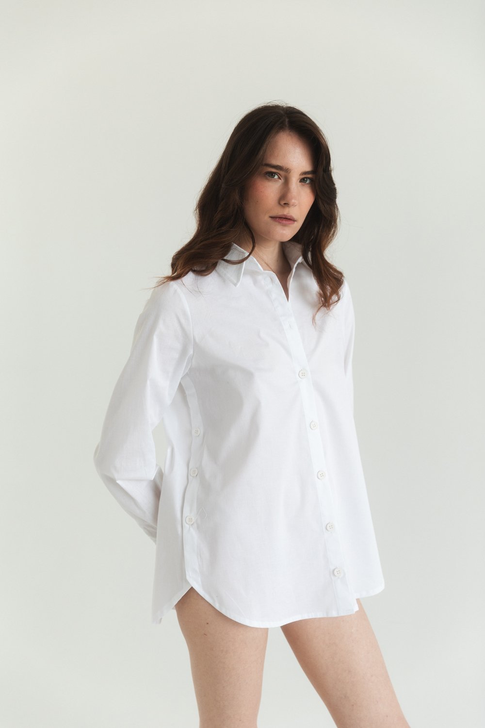 White cotton shirt with functional buttons on the sides