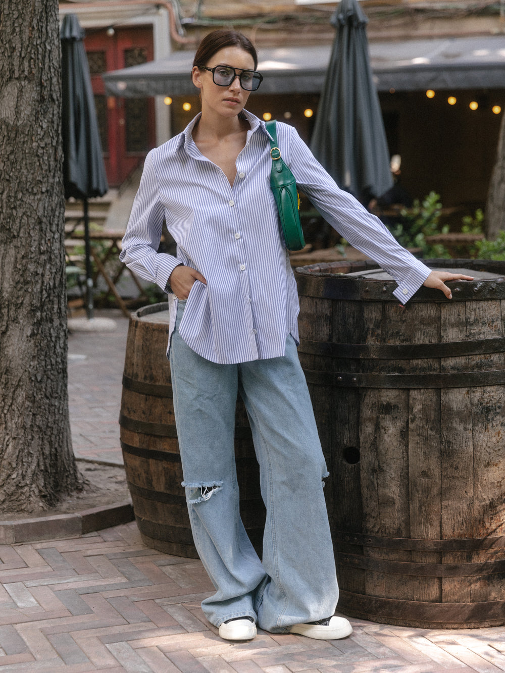 Blue cotton shirt with functional buttons on the sides