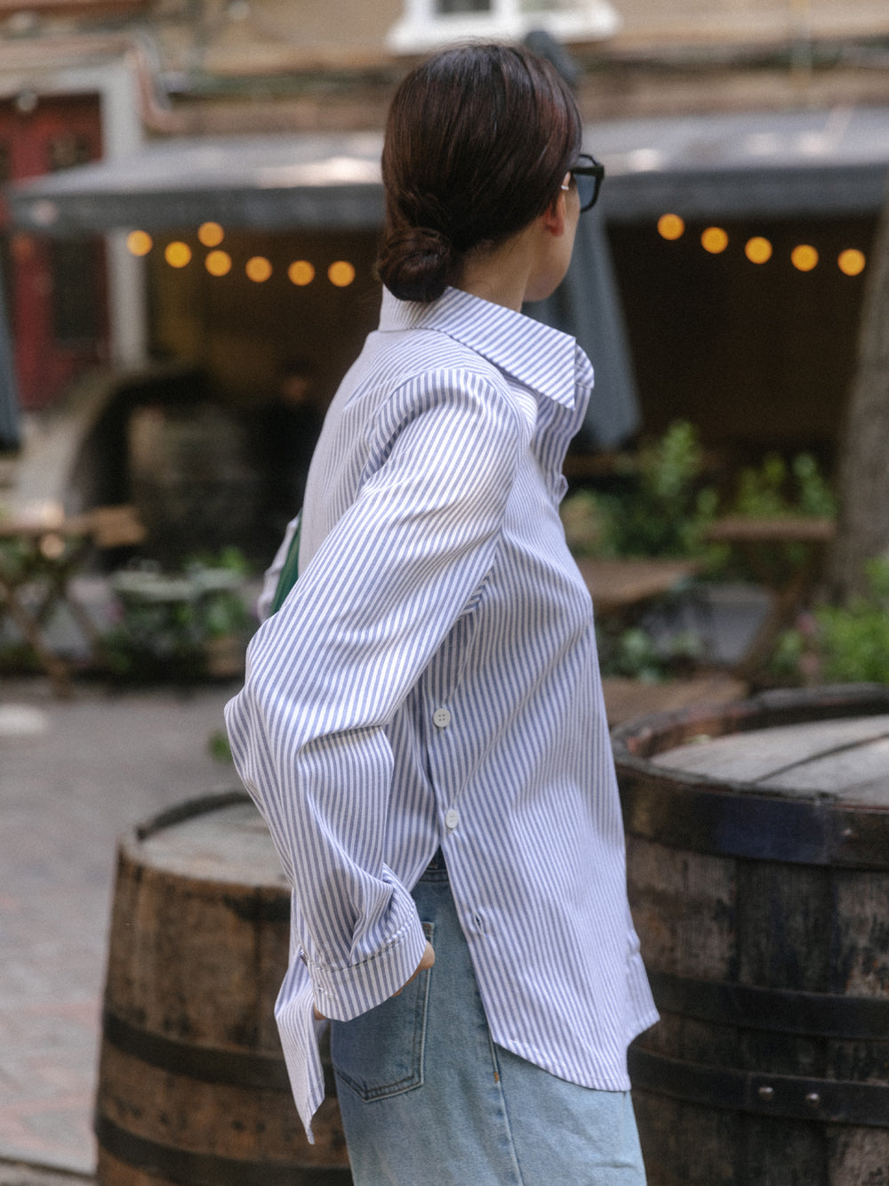 Blue cotton shirt with functional buttons on the sides