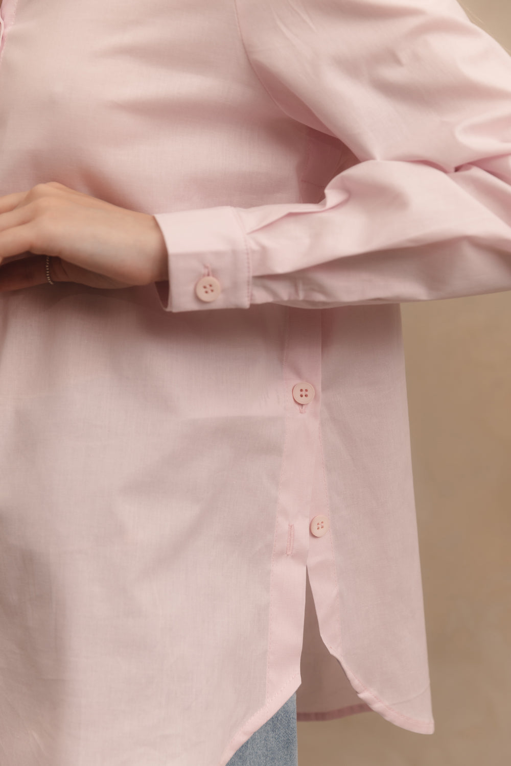 Pink cotton shirt with functional buttons on the sides