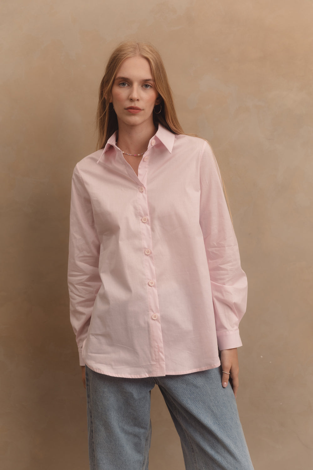 Pink cotton shirt with functional buttons on the sides