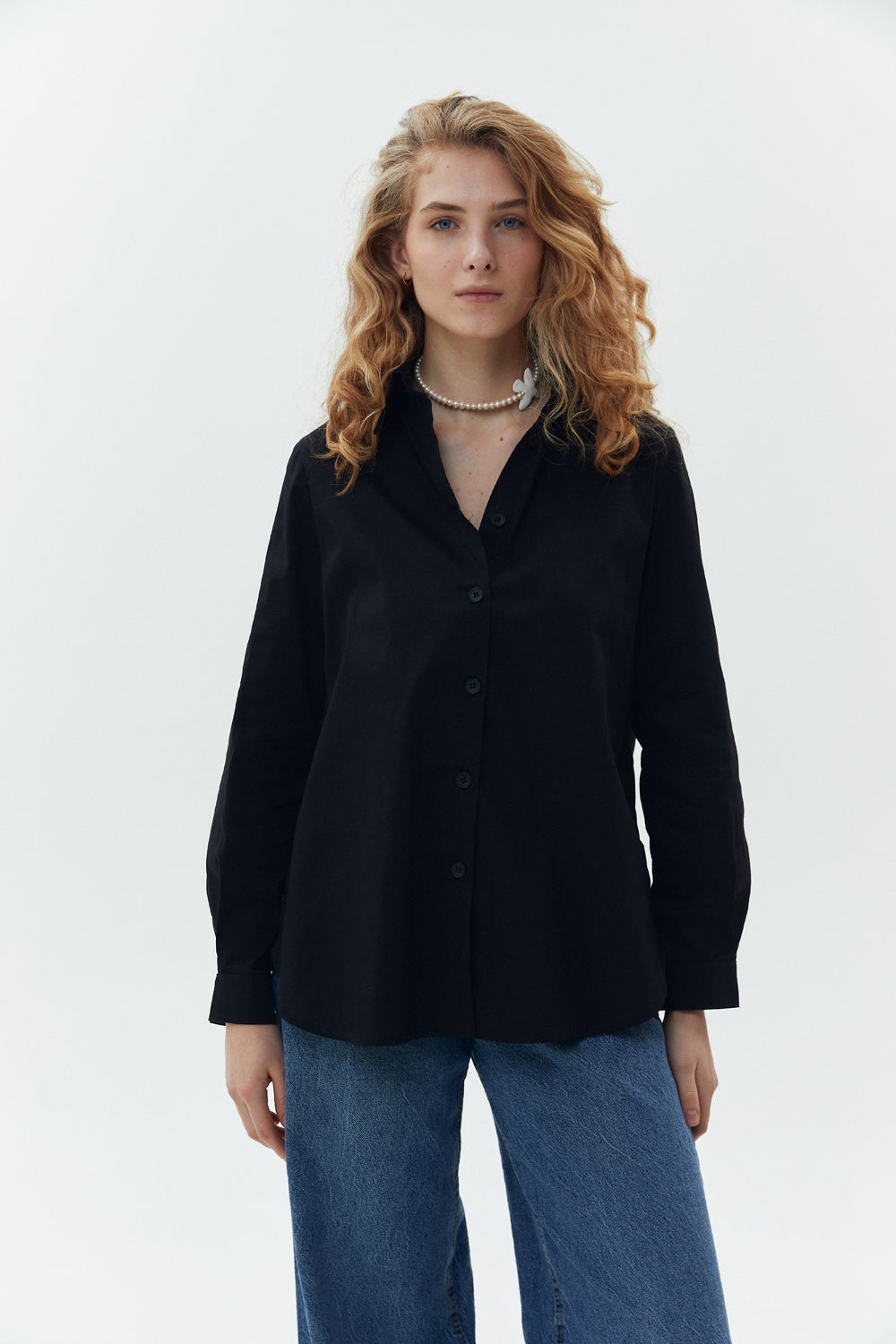 Black cotton shirt with functional buttons on the sides