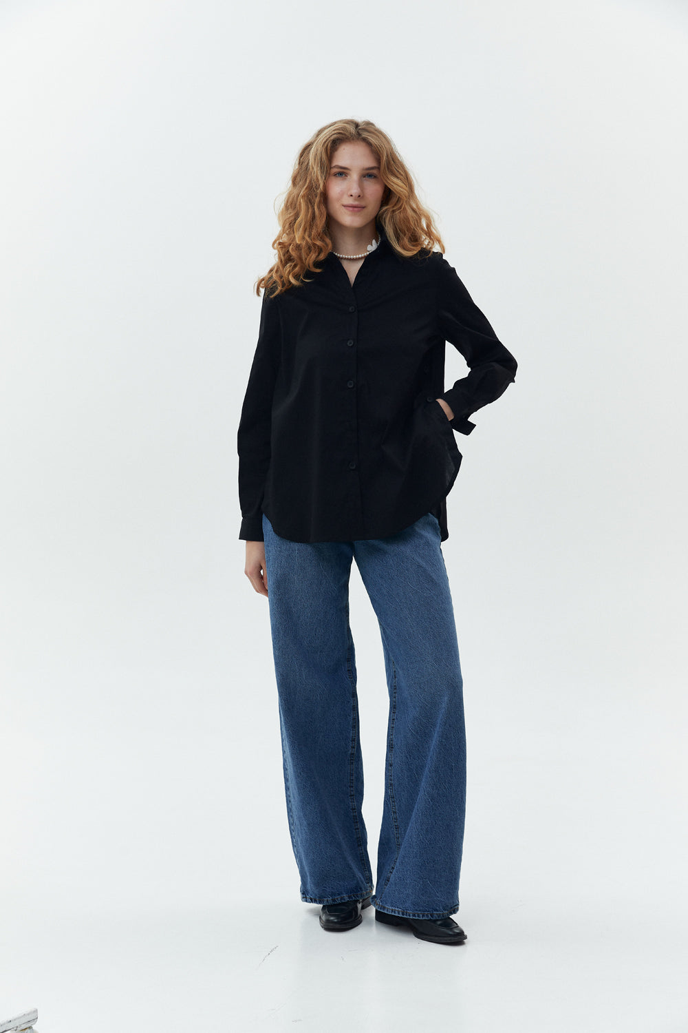 Black cotton shirt with functional buttons on the sides