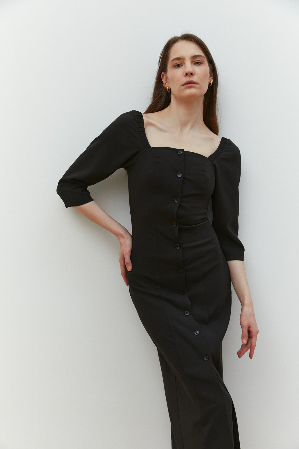 Black fitted midi dress with square neckline