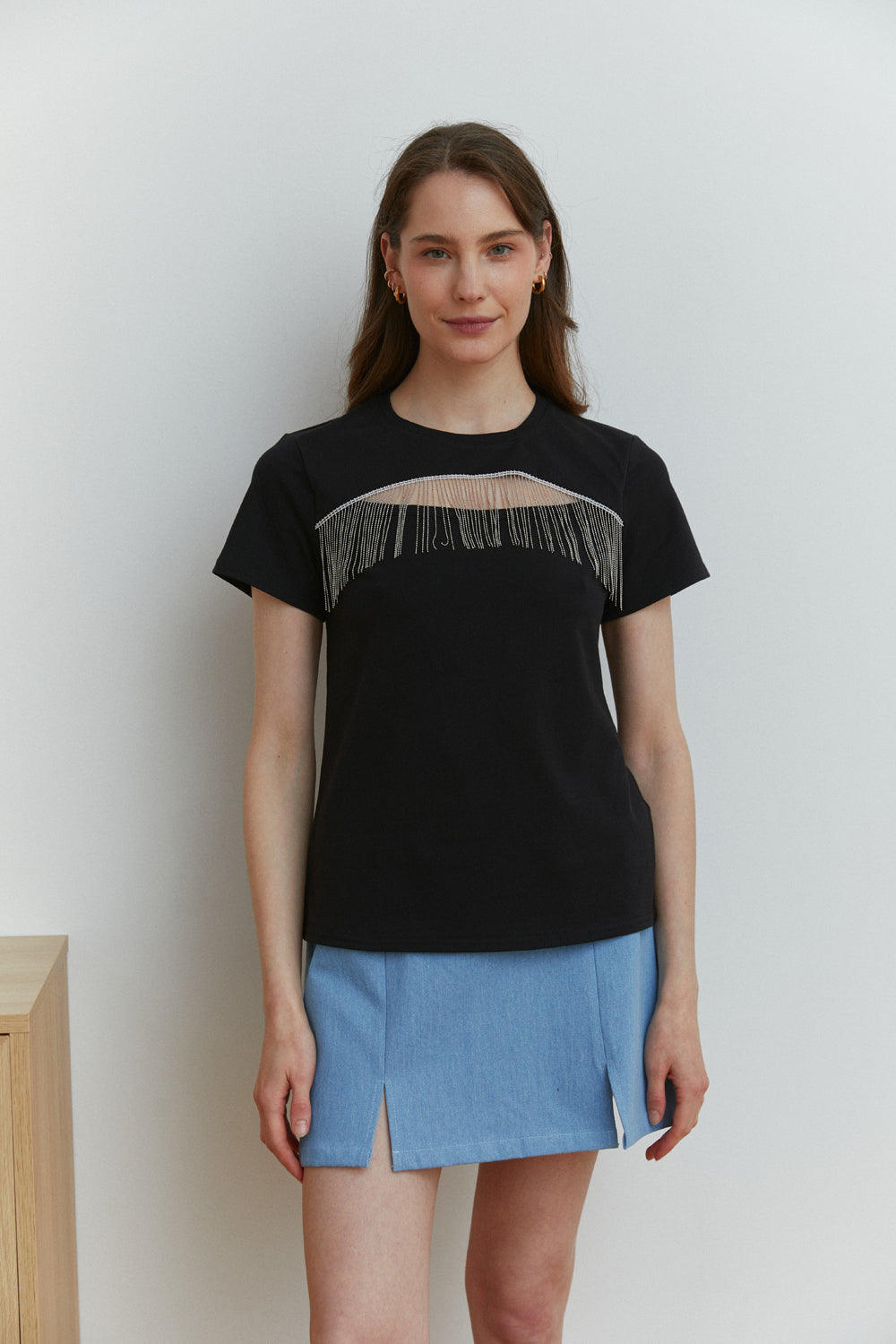 Black T-shirt with cut-out chest decorated with fringed silver beads