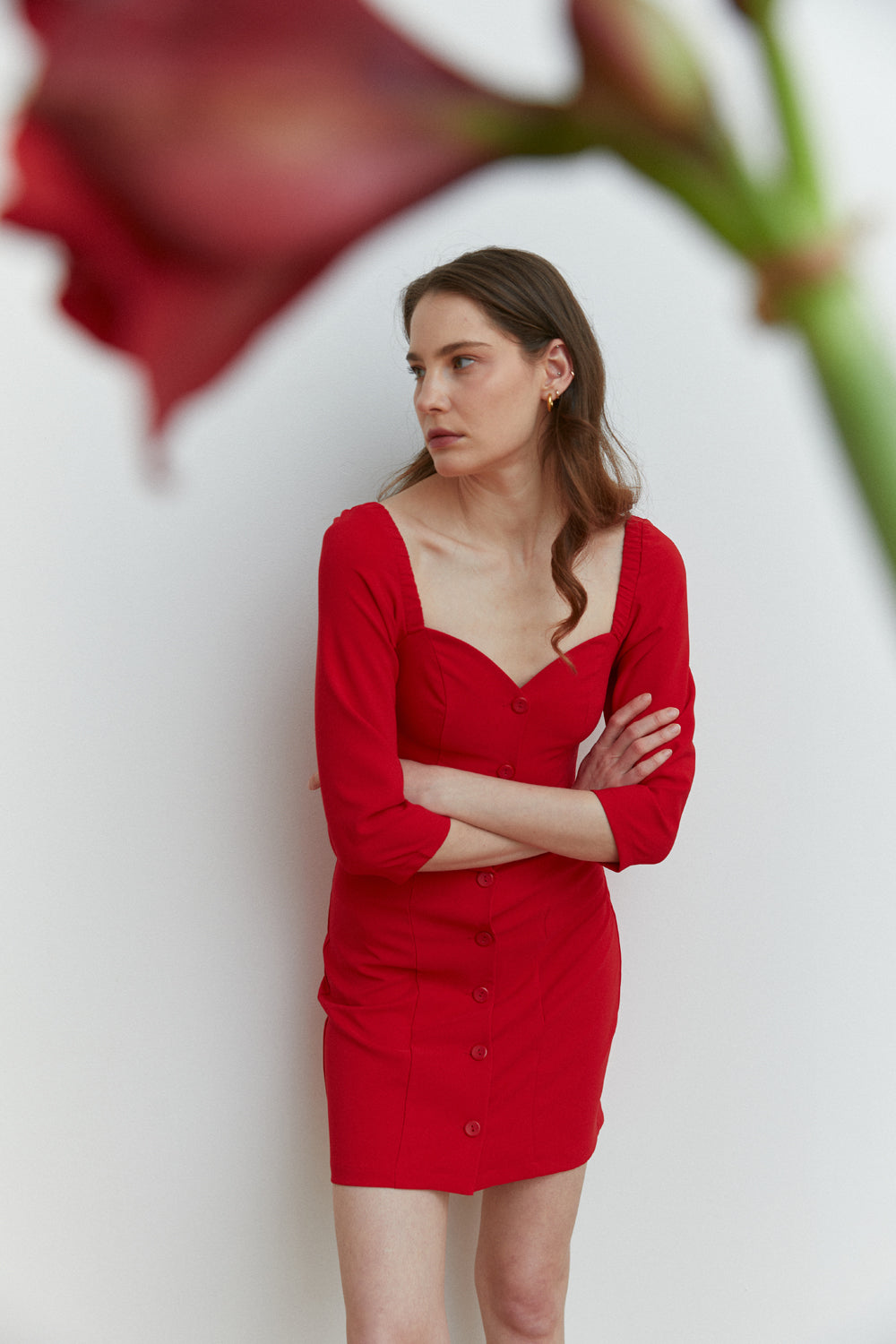 Red fitted mini dress with deep neckline