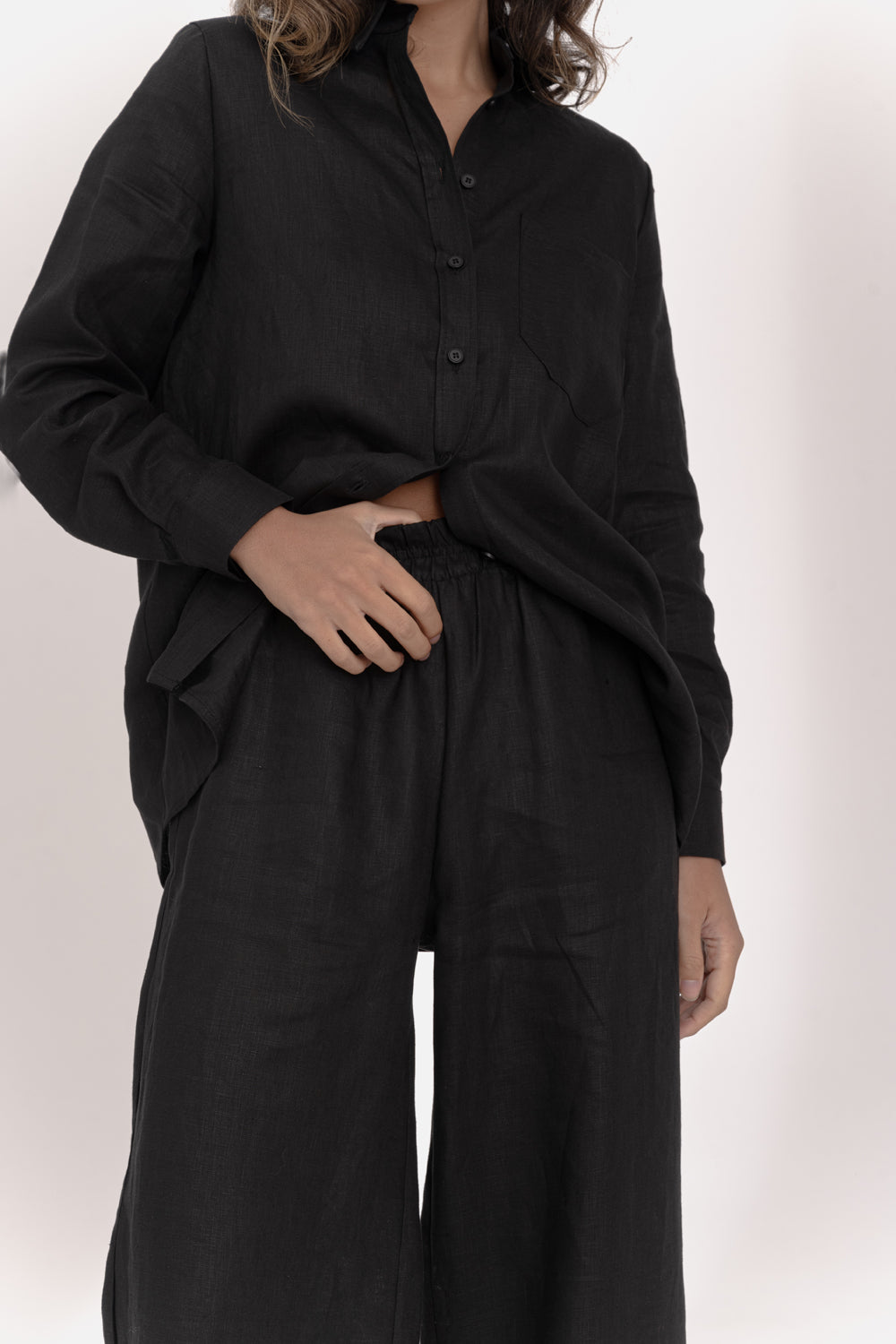 Black linen trousers with elastic waistband