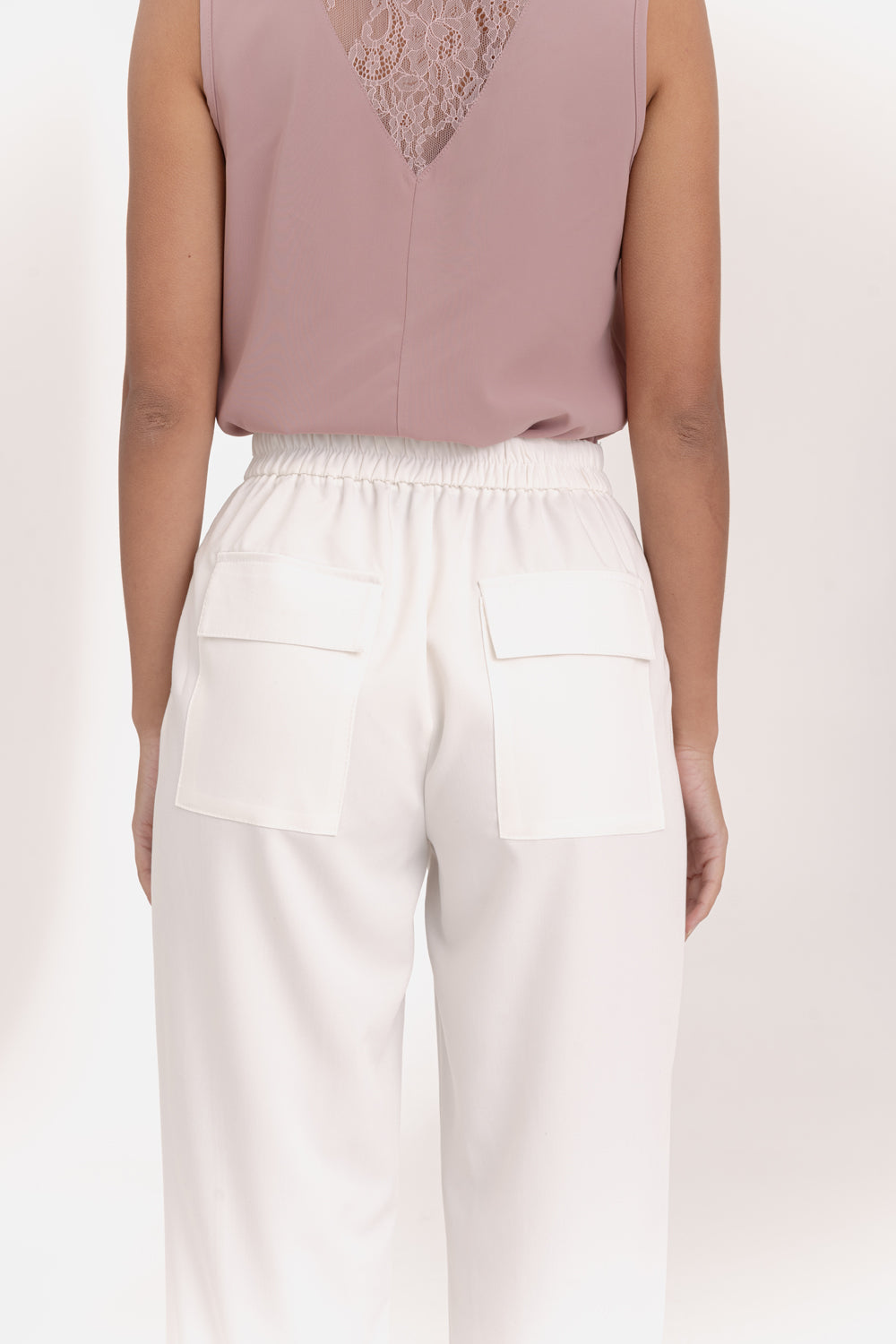 Milk trousers with an elasticated waistband and pleats at the bottom