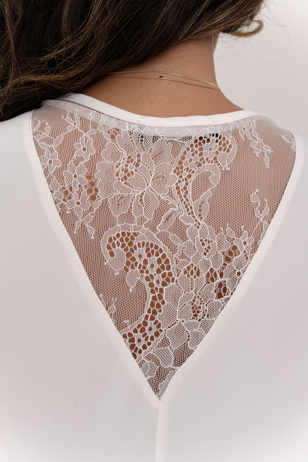 Milky sleeveless top with lace insert on the back