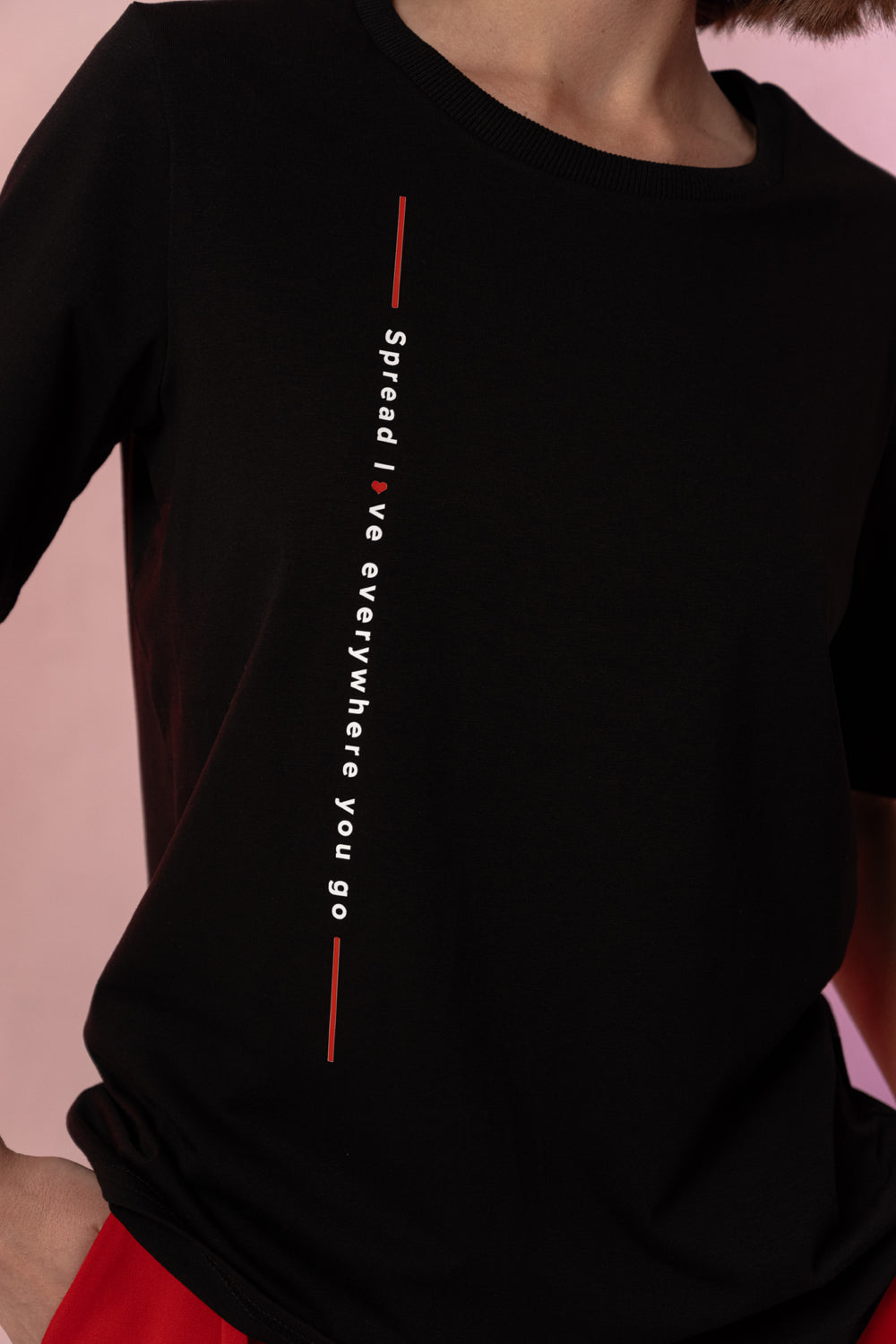 Black straight t-shirt with vertical lettering