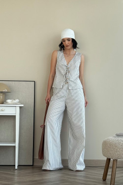 Ivory cotton trouser suit with a sleeveless bone