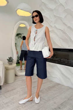 Women's white cotton bodysuit with a wide ruffle and tie straps