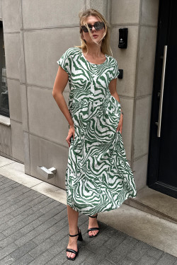 Green midi dress made of Штапель fabric with a ruffle at the bottom. Green.