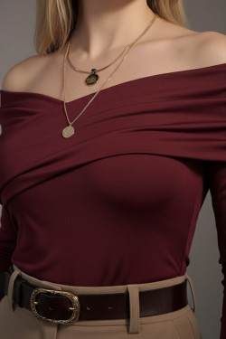 Burgundy long-sleeve top with an asymmetrical neckline made of elastic biflex fabric.