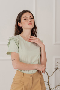 Pistachio -colored cotton T-shirt with a ruffle on the shoulder Фисташковый