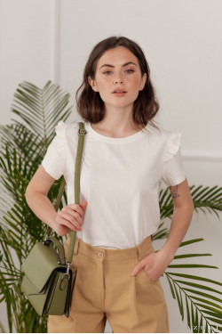 Loose-fit, milky-white cotton t-shirt with a ruffle on the shoulder . Lactic