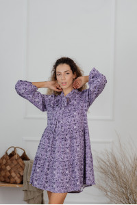 Lavender -colored, loose-fitting, short dress made of staple fabric. Лаванда