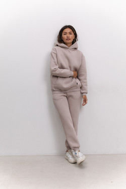 Beżowe damskie spodnie z podszewką polarową, z wysokim stanem i mankietami. Kolor Beżowy.